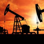 Energy oil rigs at sunset