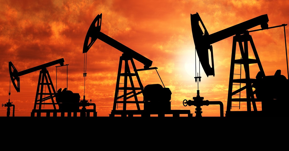 Energy oil rigs at sunset