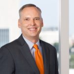 Brad Brown with Jackson Walker logo