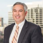 Jonathan Neerman with Jackson Walker logo