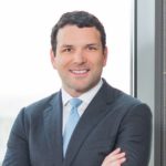 Joel Glover with Jackson Walker logo