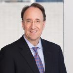 Chris Rourk with Jackson Walker logo