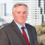 Mike Taten with Jackson Walker logo