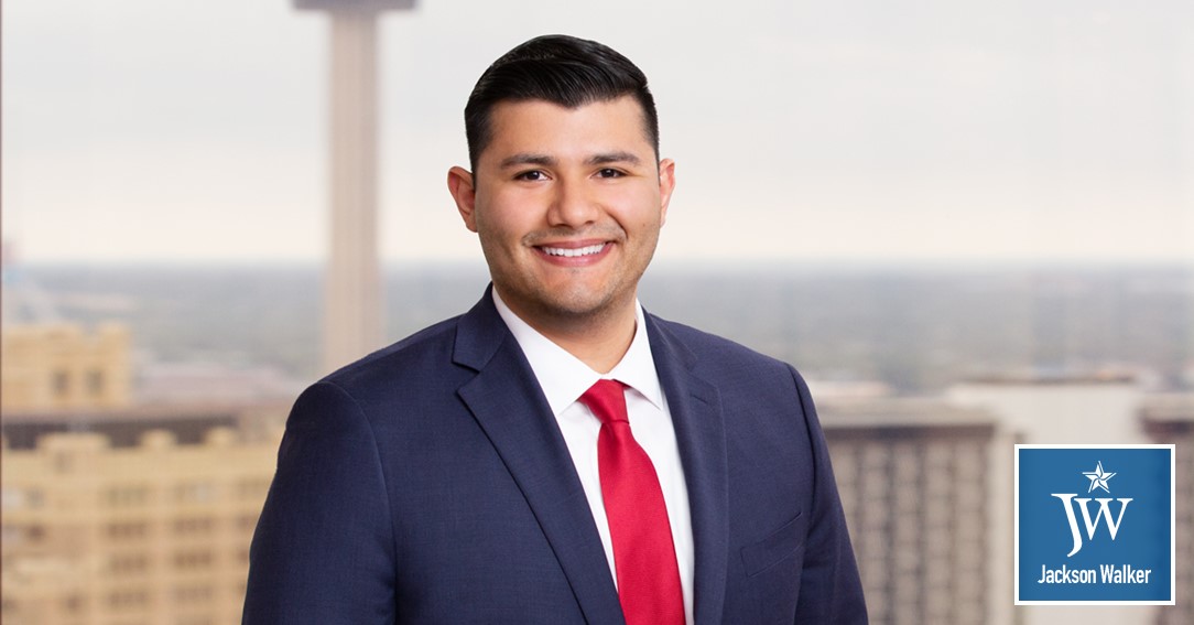 Josue Galvan with Jackson Walker logo