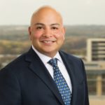 Chris Mugica with Jackson Walker logo