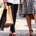 Shopping bags in parking lot with Jackson Walker logo